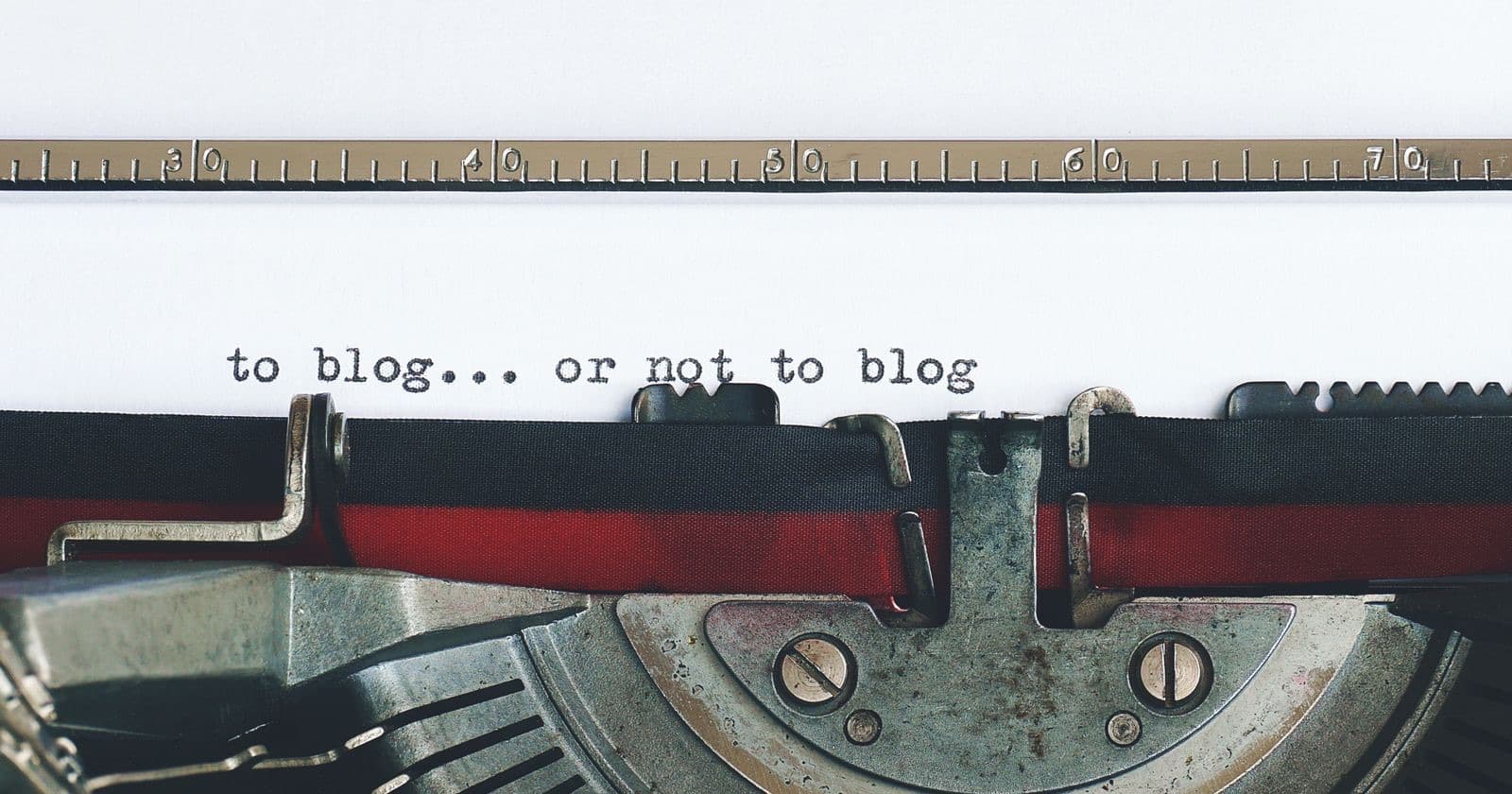 Typewriter with a sheet of paper reading "to blog... or not to blog"